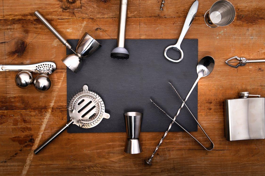 Cocktail equipment laid out on a bar